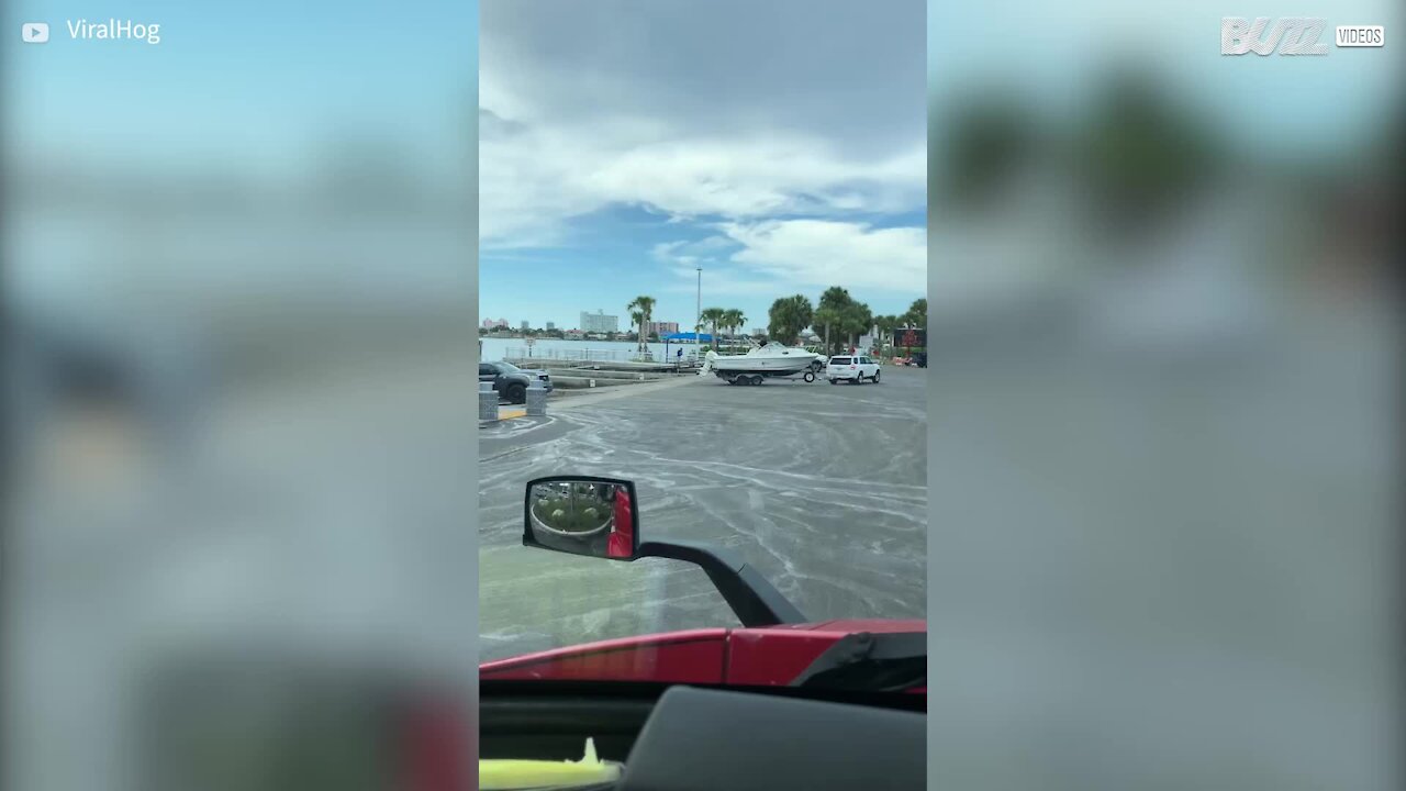 Unattached motor boat departs trailer and skids down slipway