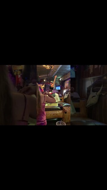 Woman on bull Wild Beaver bar