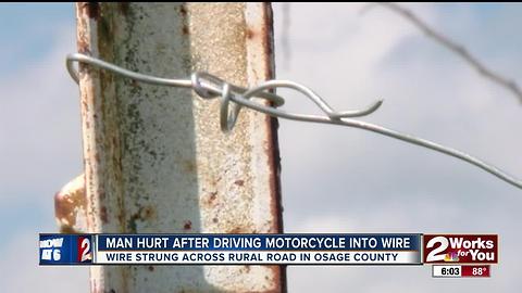 Motorcyclist survives after driving into baling wire strung across rural road