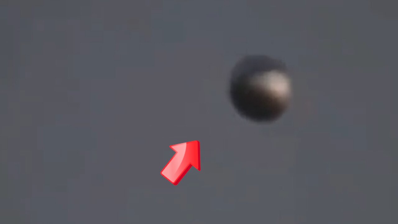 Sighting of a silver spherical UFO in the sky above [Space]