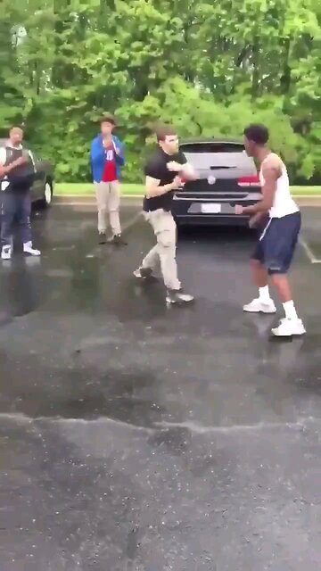 Fight: 2 guys in parking lot. Not a lot of context.