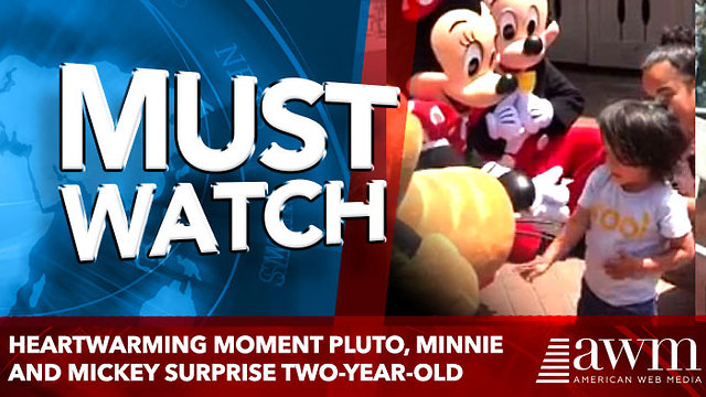 Heartwarming moment Pluto, Minnie and Mickey surprise two-year-old