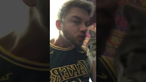 Giving a cat a kiss in my lakers jersey