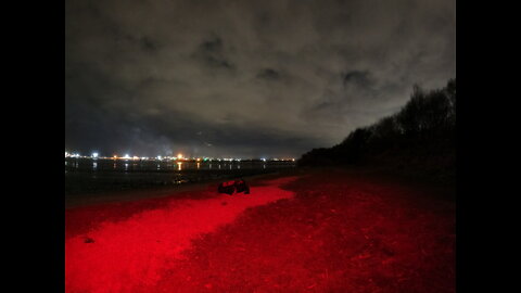 Making a brew at night by a river . Night vlog