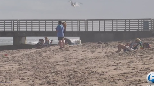 Young surfer helps save two struggling swimmers