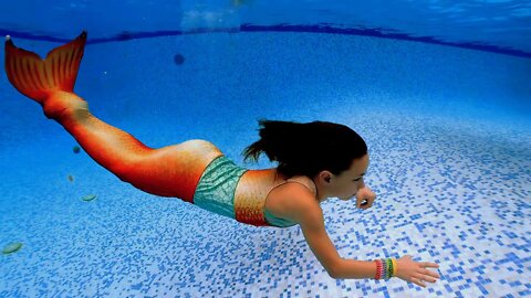 Young Mermaids Swimming in a Big Pool