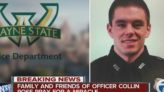 Family & friends of WSU Police Officer Collin Rose pray for a miracle