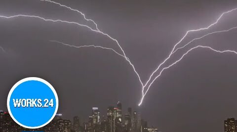 New York City skyline lit up by upward lightning during powerful storm |