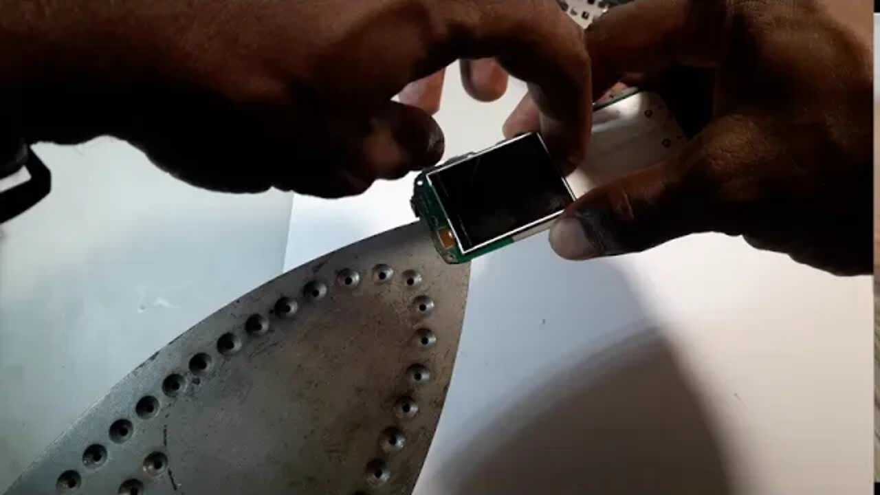 Remove glued on cellphone TFT lcd screen using a hot iron...