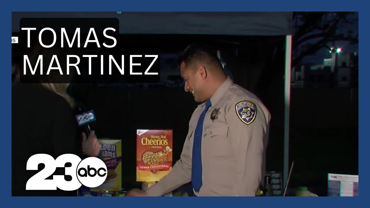 CHP Officer Tomas Martinez stops by the 23ABC Senior Food Drive