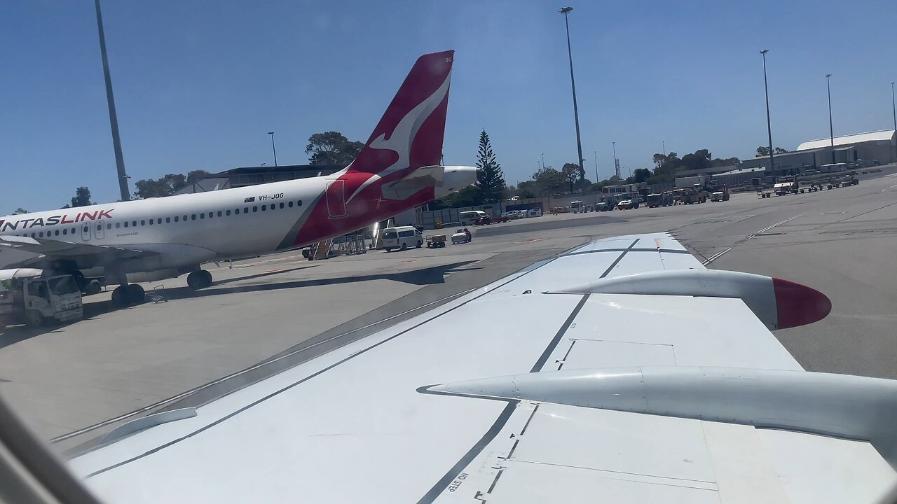 Qantas Fokker 100 pushback Perth Airport YPPH