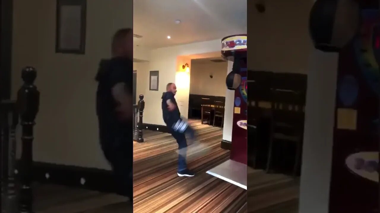 Brave Fella Takes Tries A High Kick On A Punching Machine And Falls