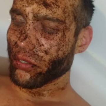 Guy ironically falls asleep with coffee on his face in the tub