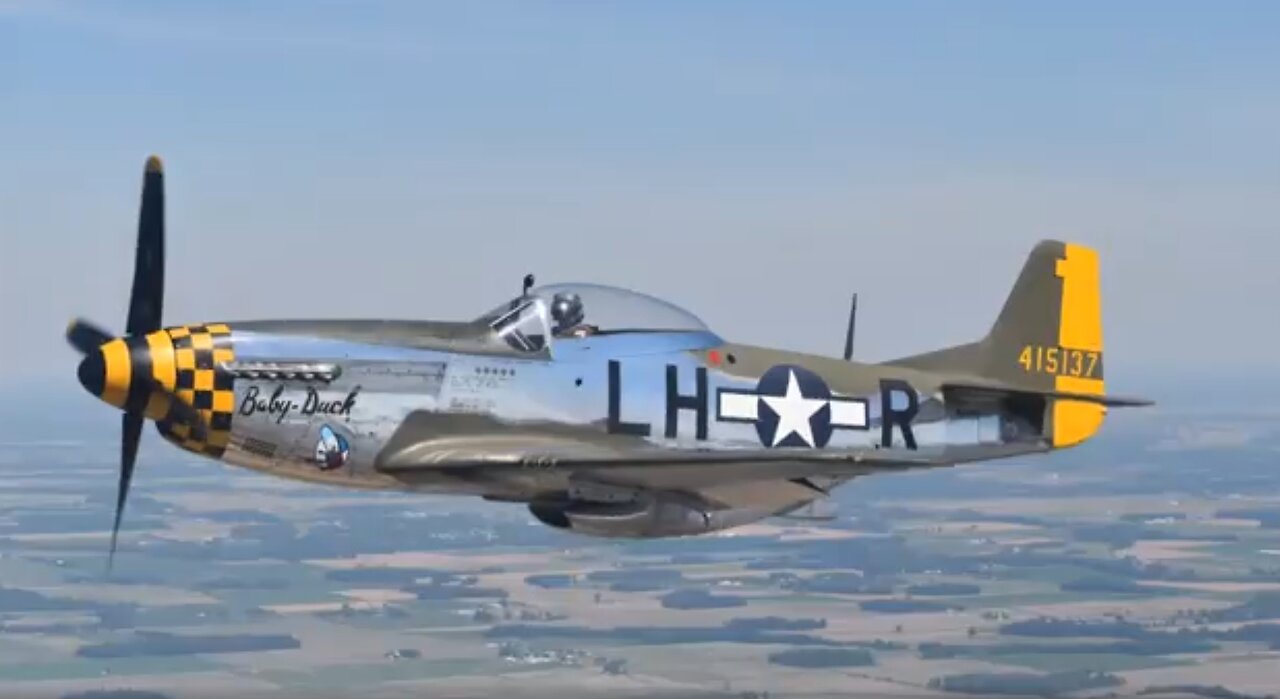 P-51 WWII aircraft formation flying with a Piper Arrow