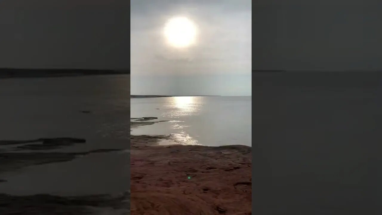 Climbing cliffs on a hot beach day