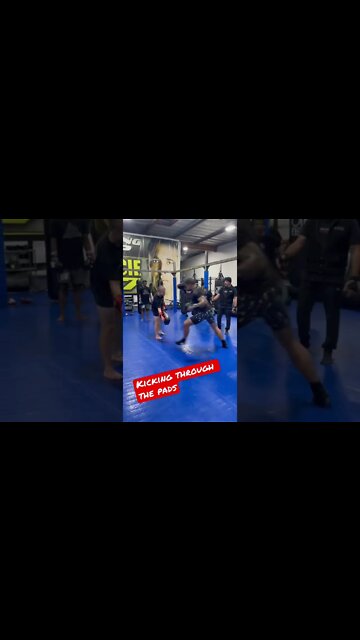 Kicking through the pads - Muay Thai
