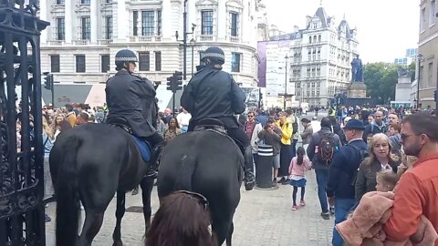 police on horse back make their way through the crowd #horseguardsparade