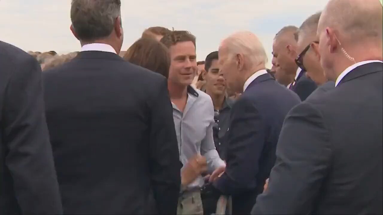 Joe Biden nibbles on scared little girl on his visit to Finland.