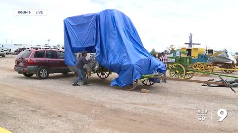 Rain and wind not slowing Rodeo Parade prep work