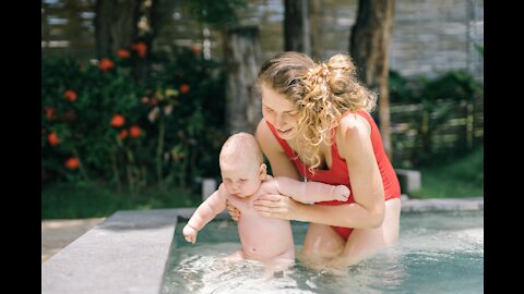 Cute baby swim in pool