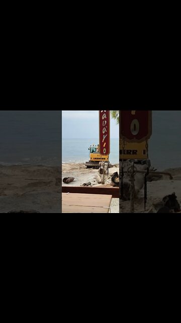 Excavator repairs the beach after the storm#viral #beach #sand