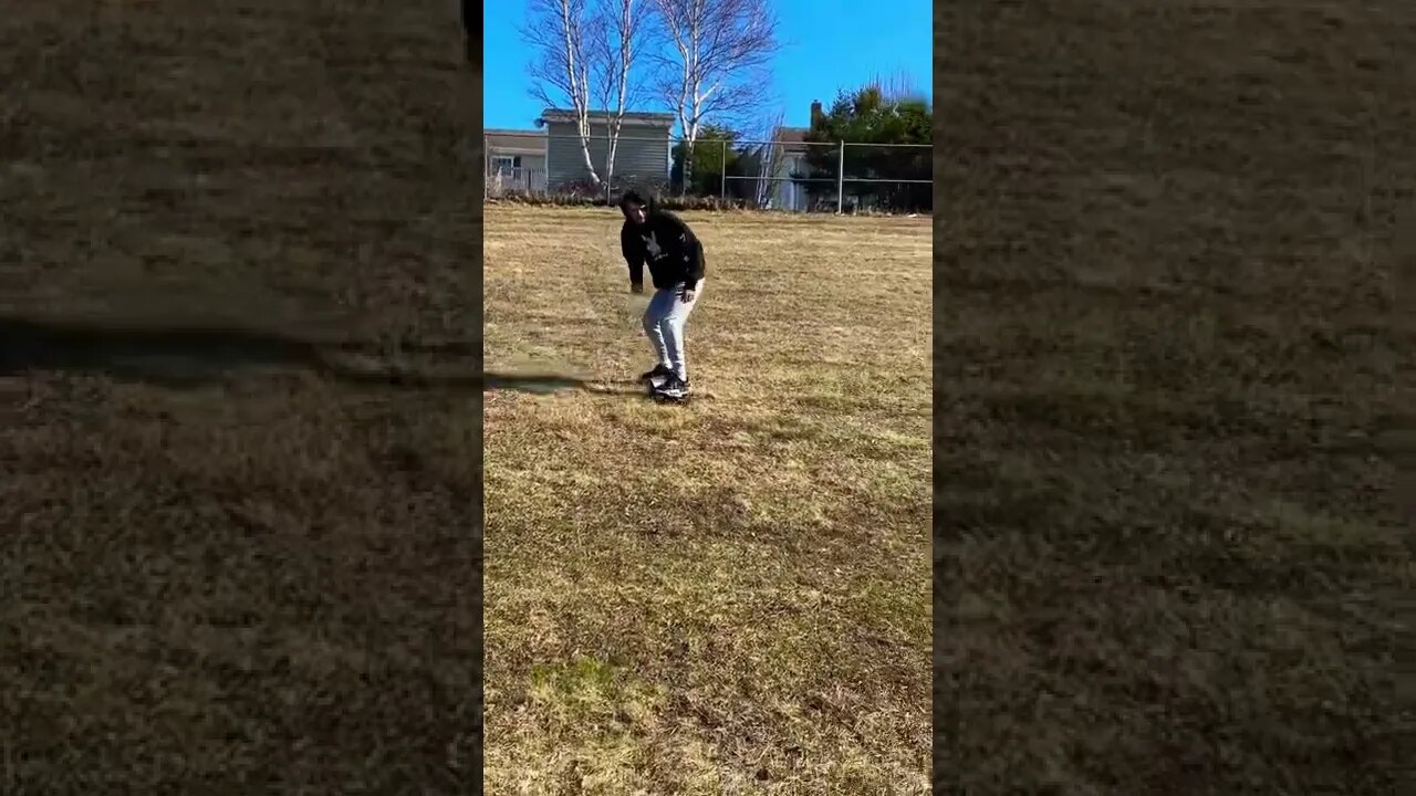 Long boarding wipe out on grass