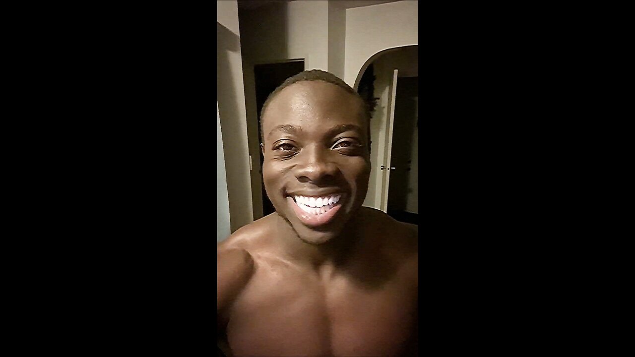 Black man smiling in the dark