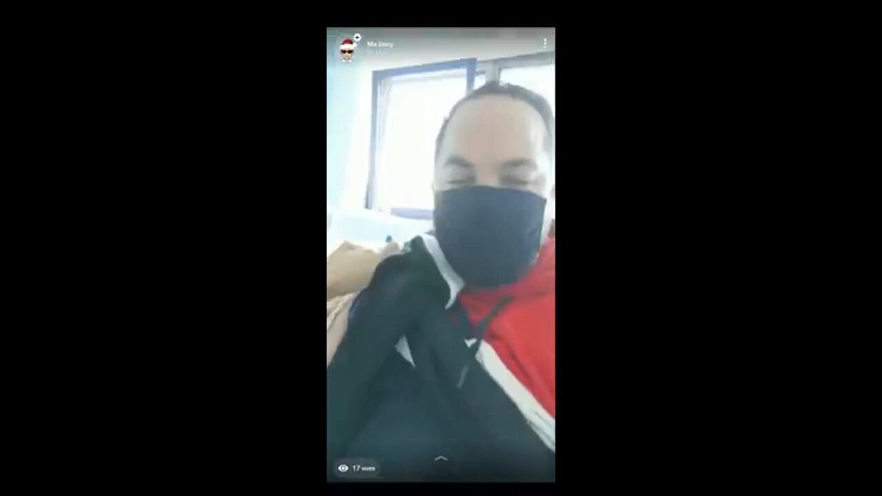 MAN CHARGES PHONE WITH HIS ARM AFTER VACCINE