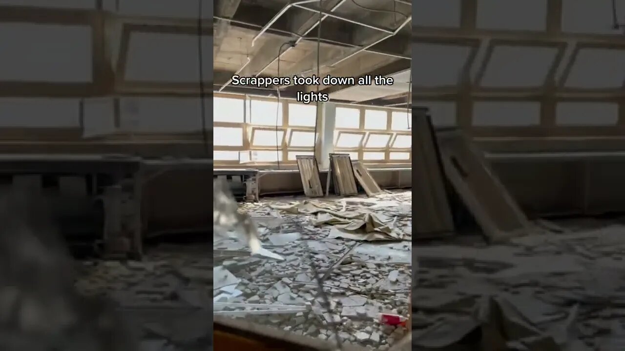 Scrappers taking down all the lights inside an abandoned Chicago school￼