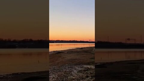 Watching the sunset off a beach