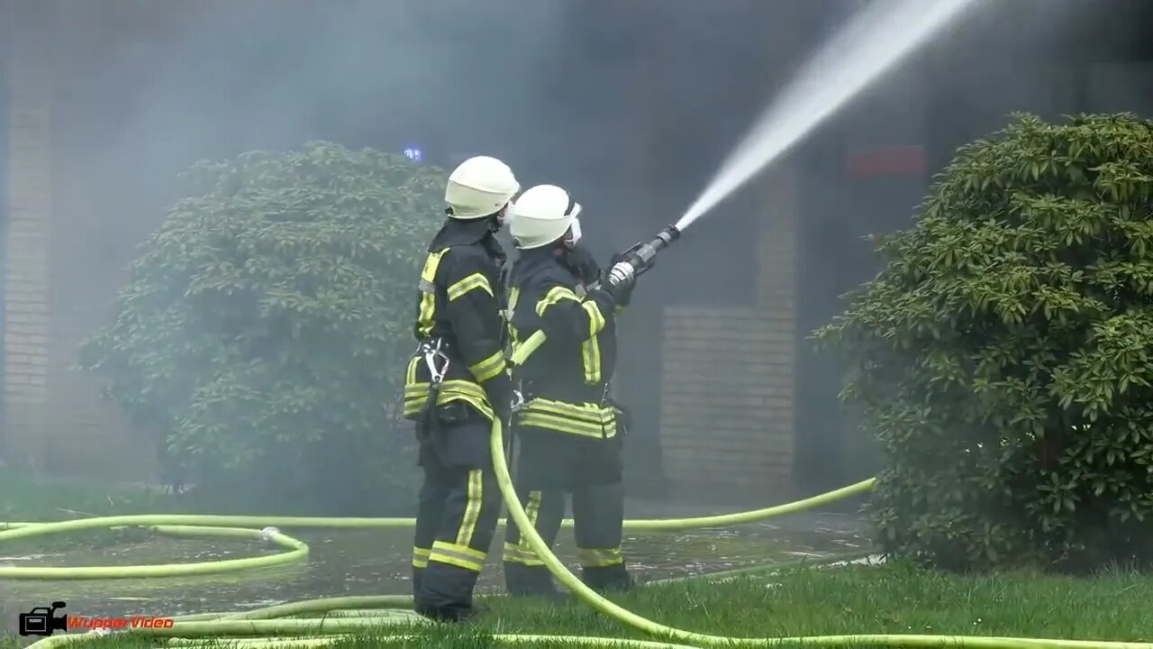 17. Smoke billows from thatched cottage fire