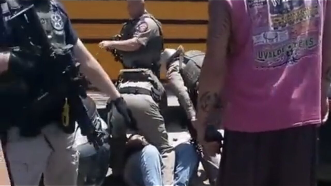 Cops stood outside the school while the killer rampaged inside.