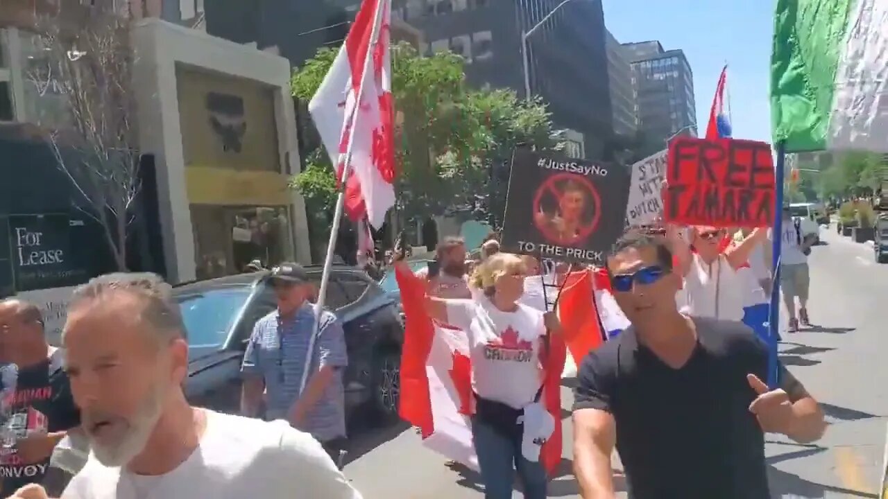 Canadians hold Netherlands flags to show solidarity with the