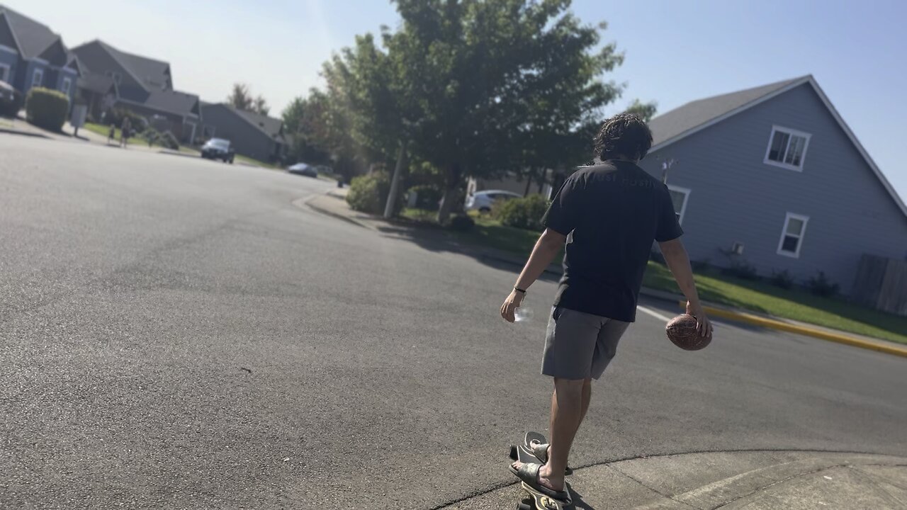 Yung Paul Riding Longboard