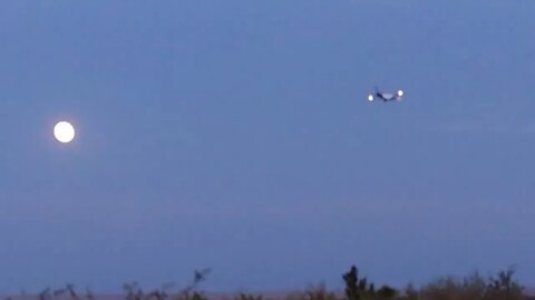 Full moon behind landing