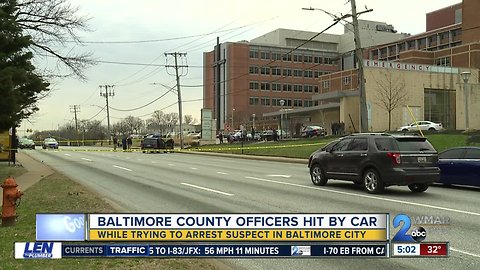 Two Baltimore County officers hit by car while trying to arrest suspect in city