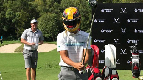 Steph Curry Plays Golf in an F1 Racing Helmet