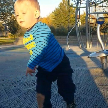 A Little Boy Is Super Dizzy After Riding A Merry-Go-Round