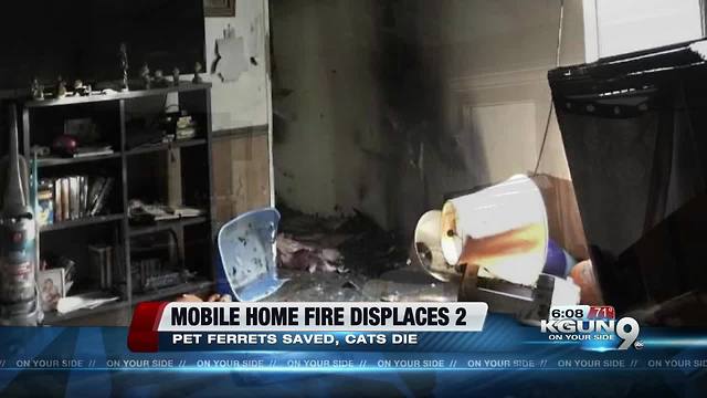 Two people lose mobile home in blaze