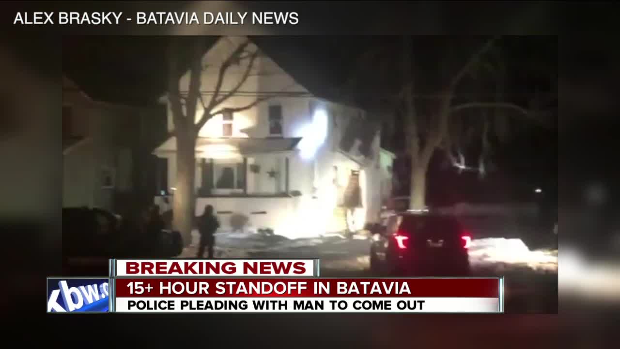 Crews working to end standoff involving man threatening people with sword inside Batavia home