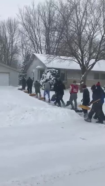 Lomira wrestling team digs their neighbors out of snow