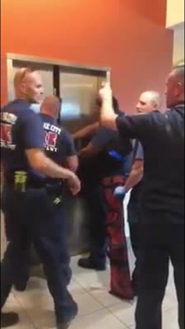 Hilarious video of firefighters rescuing police from elevator
