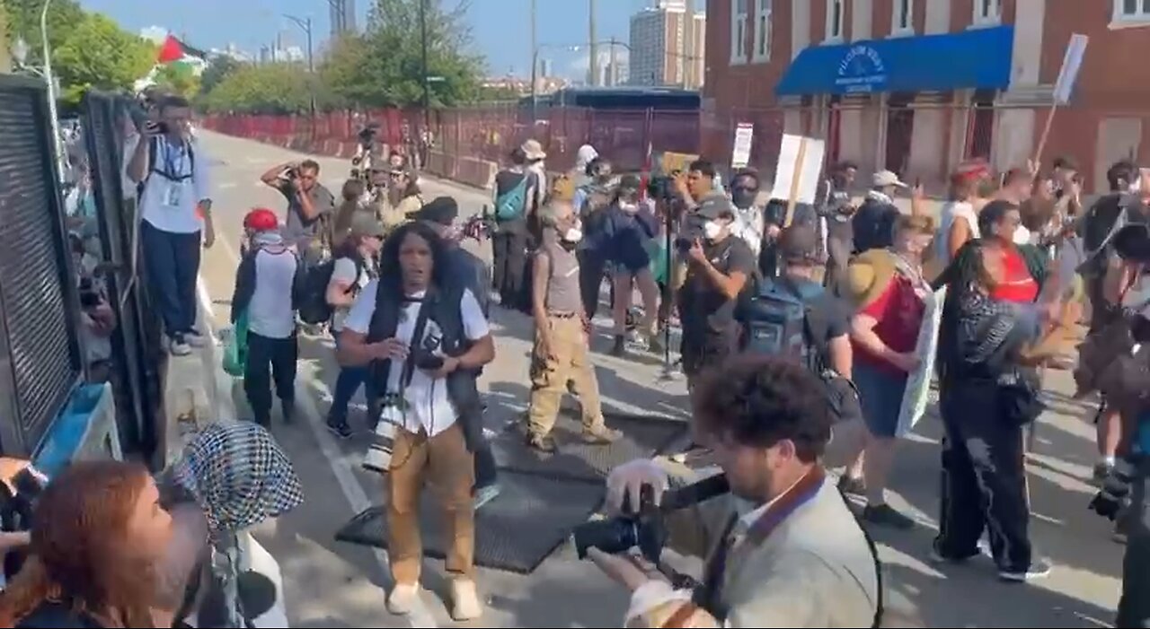 Protesters have breached the security perimeter fence surrounding the DNC in Chicago