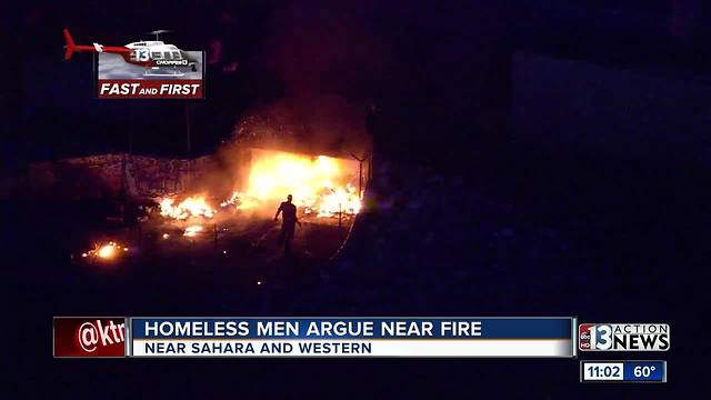 Two homeless Las Vegas men argue near fire