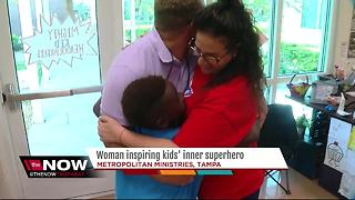 Woman inspiring kids' inner superhero