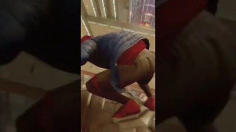 Spider-Man Miles Morales trophy riding rhino through a mall and dodging Christmas shoppers