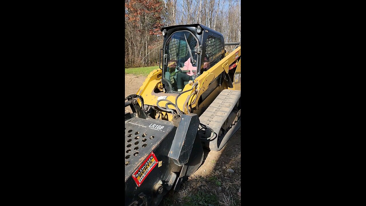 Cat skidsteer with s rock hound