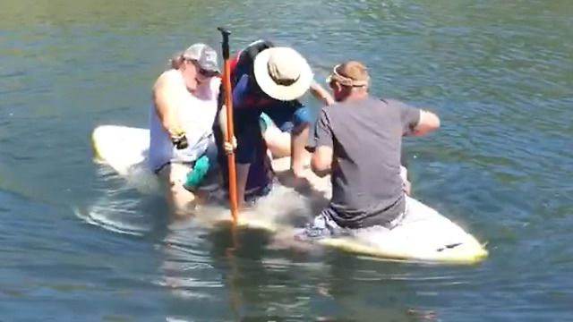 A Family On A Raft Fall Into A Lake