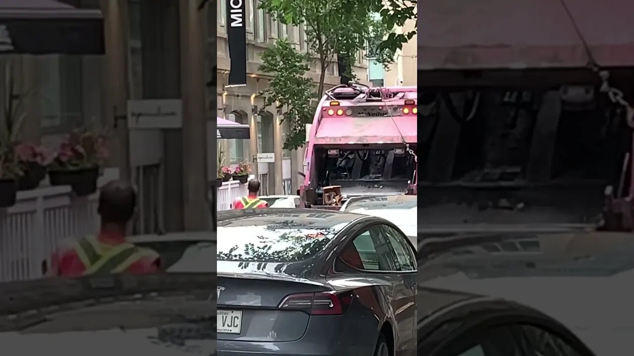 Garbage collector keeping the busy downtown clean