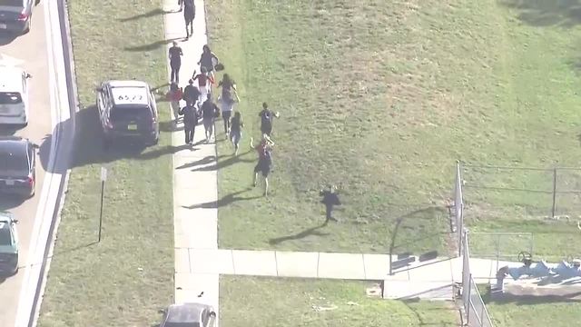 Students evacuate building after mass shooting